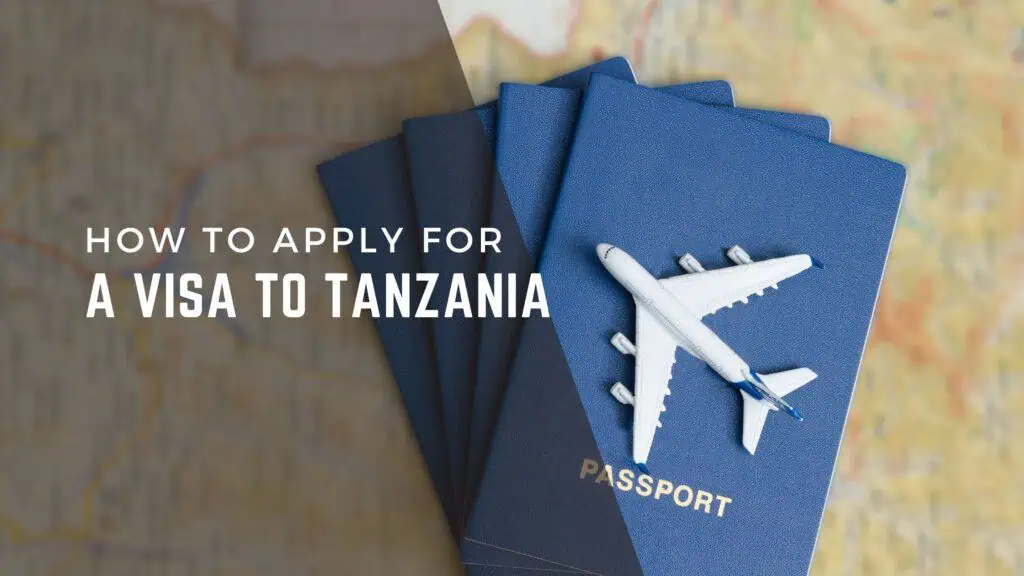 Passport and airline tickets on a map, representing travel planning for Tanzania safaris and visas.