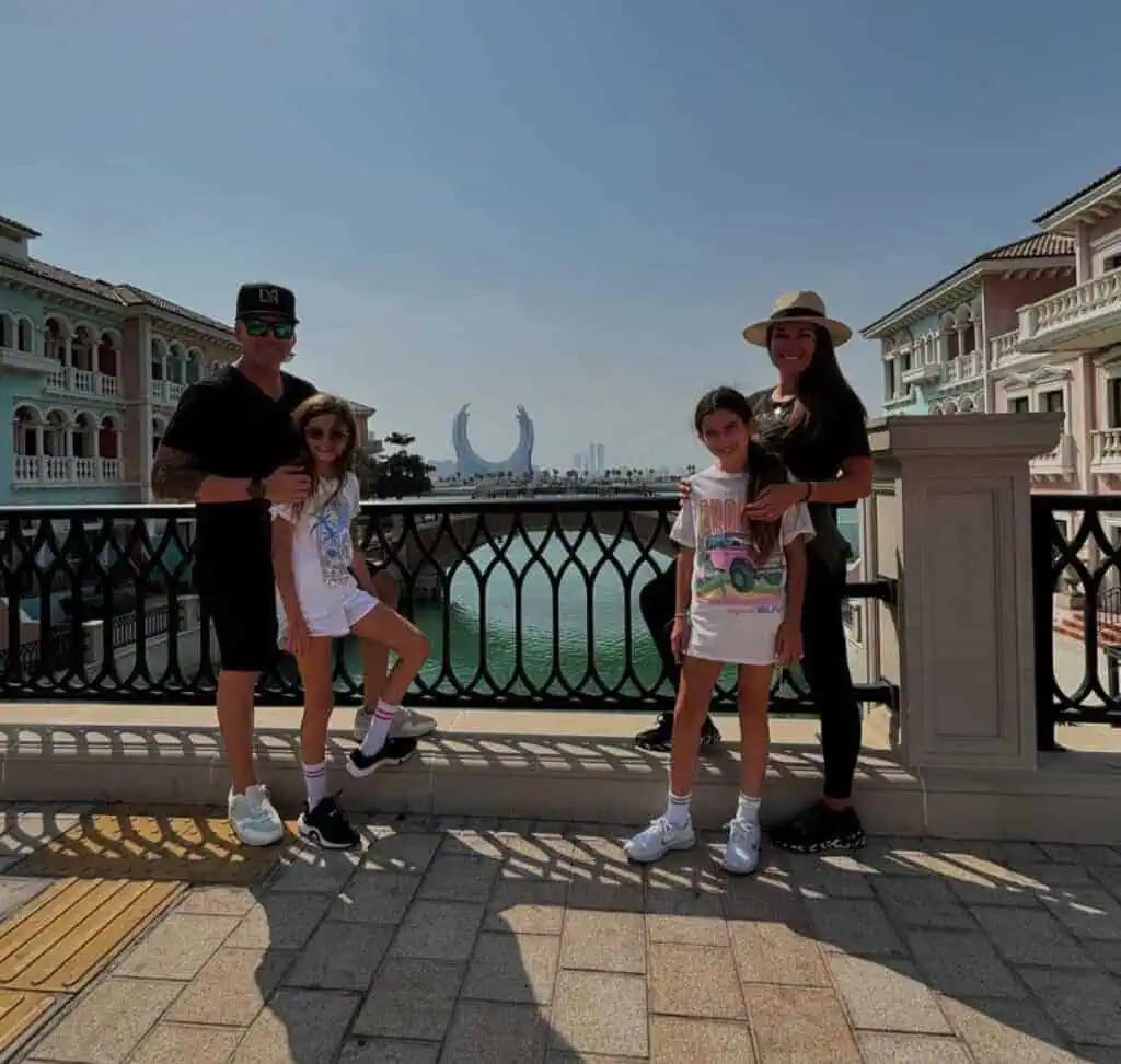 Family enjoying a scenic view in Dubai with iconic architectural landmarks in the background, ideal for African safari travel enthusiasts seeking luxury family adventures.
