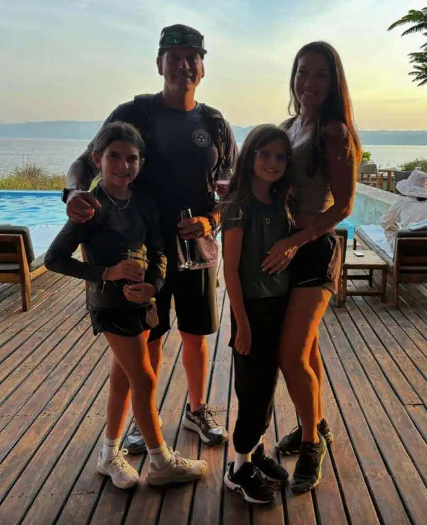 Family enjoying a sunset at an African safari lodge with scenic lake views and luxury accommodations. Perfect destination for family safaris, nature lovers, and wildlife explorers in Africa.