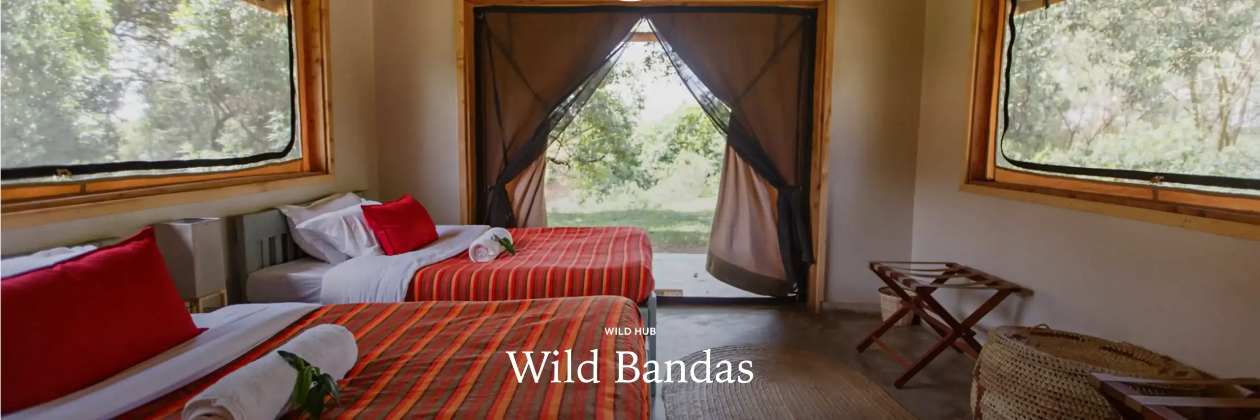 Cozy safari tent with luxurious beds and scenic views of nature. Perfect for an authentic African safari experience in a comfortable, rustic setting.