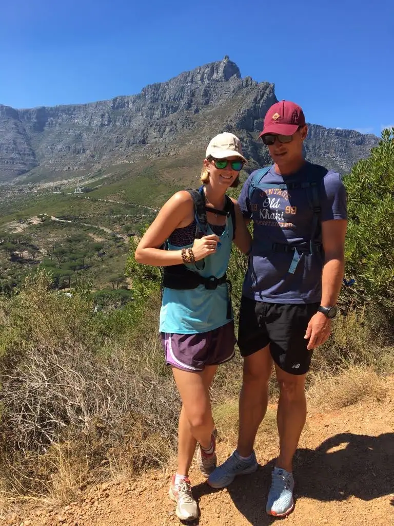 Me and a friend hiking with a mountain behind us
