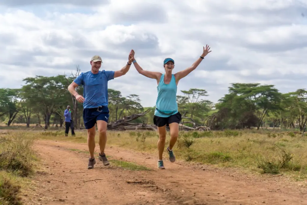 Me running the Lewa half marathon, arms in the air
