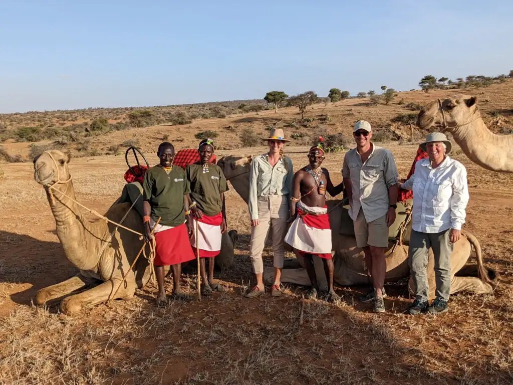 Me with friends and Samburu guides beside our camels on a camel trek at Loisaba